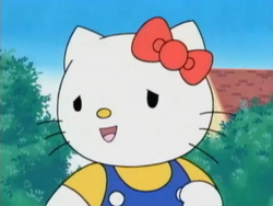 Kitty puts her hand on her chest.png