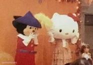 Mascot costume pictured with Hello Kitty.
