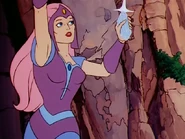 Glimmer is using a crystal to signal She-Ra and Swifty.