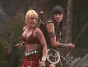 Xena and Gabrielle fighting side by side.