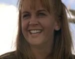 Gabrielle laughing as Xena performs the longest flip