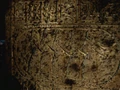 Sumerian glyphs depicting the first trial on a pyramid wall