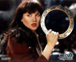 Xena's descendant, Melinda Pappas, holding the Chakram (XWP: The Xena Scrolls)