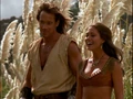 Hercules and Nemesis watch Iolaus teach Evander how to fish