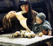 44325902 294198764525122 1133507126460689736 n.jpg (85 KB) Xena reads a story to baby Eve.