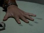 Solan matches his hand to the handprint of his father (XWP: "Orphan of War")