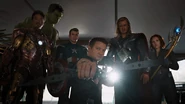 The Avengers team apprehends Loki