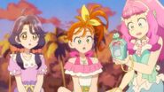 Sango, Manatsu and Laura are surprised as Kururun flies into the Mermaid Aqua Pot.