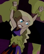 Tara constrained by her midriff and wrists in Gill’s slime.