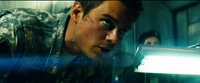Lennox watches as Glenn's phone was turned into a Decepticon from the AllSpark.