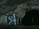 Aang unmaking the Blue Spirit (Zuko in disguise).