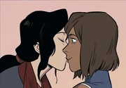 Asami kissing Korra on the cheek.