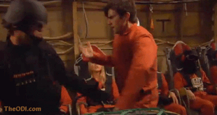 Behind the scenes image of Peter (Milo Ventimiglia) fighting a guard. A hooded female fugitive 2 is seen in the background on the right