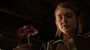 Emily with a flower