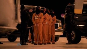 A row of hooded fugitives(2nd, 3rd, 5th and 6th are a hooded , ,  and , 4th may be a hooded )