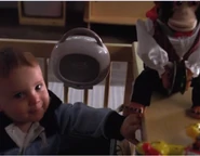 Matt Parkman Jr. activates toys such as a monkey doll...