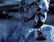 In her rage, Tracy unintentionally freezes the reporter Jim McCann.