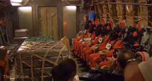 Behind the scenes image of the hooded prisoners of the right side of the plane being seated (From down to up: Sparrow Redhouse, female fugitive 2, male fugitive (or Flint Gordon), Tracy (Ali Larter), Hiro (Masi Oka) and a hooded fugitive