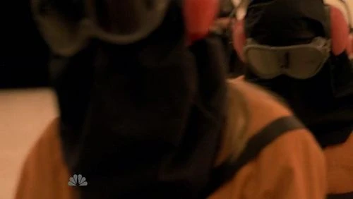 Tracy and male fugitive (possibly Flint Gordon) being led