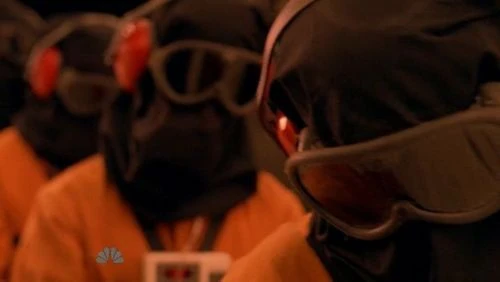 The prisoners being inspected (Matt, female fugitive, hooded fugitive and Mohinder)