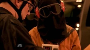 A hooded Tracy with her hair slipping out