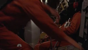 Peter gets knocked down by a guard. A hooded Sparrow is sitting while the action takes place.