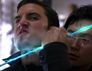 Peter conducts electricity through Hiro's sword.