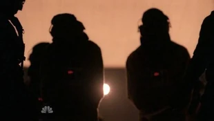 The hooded prisoners entering the plane