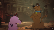 Courage being confronted by Scooby-Doo.