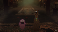Courage and Scooby-Doo staring down the monster.