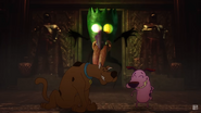 Courage and Scooby-Doo laughing in relief.