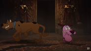 Courage and Scooby-Doo walking backwards.