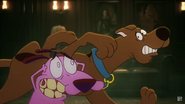 Courage being requested to deal with the monster by Scooby-Doo.
