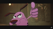 Courage reaching out with his thumb up.