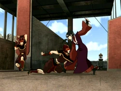 Mai fights off gondola guards to help Zuko's group escape.
