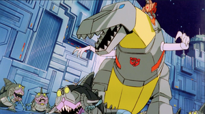 Grimlock roaring at the Sharkticons.