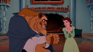 Belle admiring her gift, because the Beast has a change of heart after he saved her from the wolves and she healed his arm