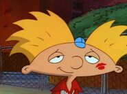 Arnold, with Maria's red lipstick mark on his cheek