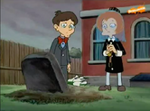 Young Mitzi and Phil crying on Pooter's grave.