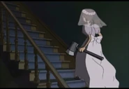 The Ghost Bride climbing the stairs, intent on killing her sister and former fiancé.