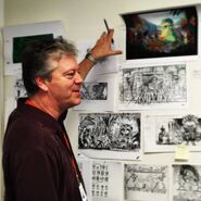 Craig during the production of the rebooted film, with the original film's art on a wall. Bigger version here.