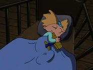 Baby Arnold sleeping with a toy airplane in his arm