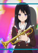 Reina holding her trumpet