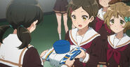 Hazuki recieving her band uniform