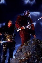 The Krugan(Clancy Brown) and Ramirez(Sean Connery) in Highlander.