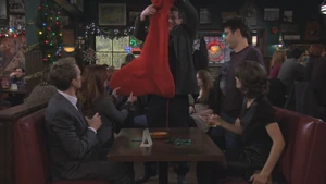 Marshall showing the gang his son's Christmas stocking