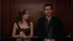 Ted and Vicky flirt in the elevator.