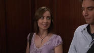 Vicky and Ted flirt in the elevator.