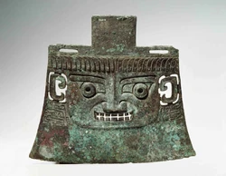 Painted Ceremonial Ax (Chinese, Shang Dynasty, ??? BCE). Qingzhou, Subutun Tomb (??? BCE). Bronze with Green Paint. From collection of Museum of the Asian Art, Berlin, Germany.