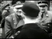 Axmann with Hitler and a Youth Soldier.
